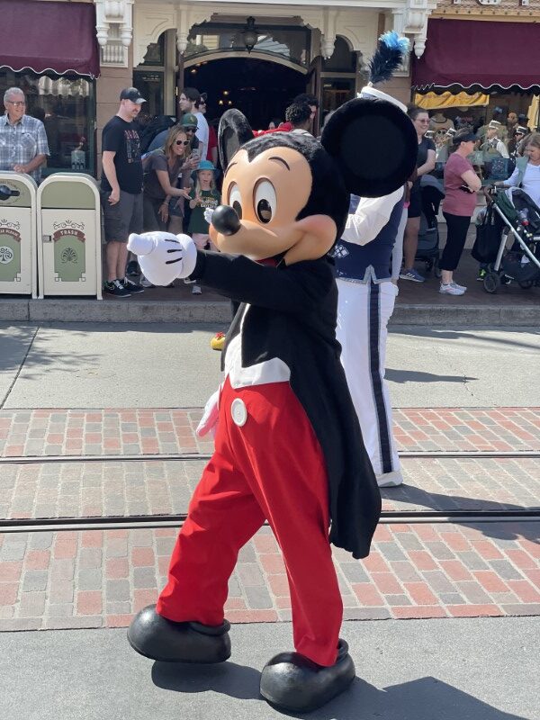 Mickey in a parade. Disneyland versus Disney World: A Florida Family's Perspective. 