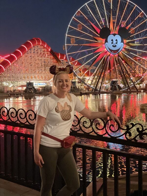 Michelle Olson-Rogers at Pixar Pier at night. Disneyland versus Disney World: A Florida Family's Perspective