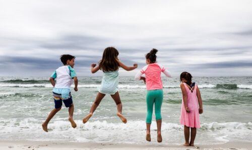 kids jumping for joy that school is out and they get to go to south florida winter break camps